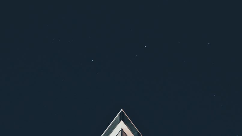 white building under stars