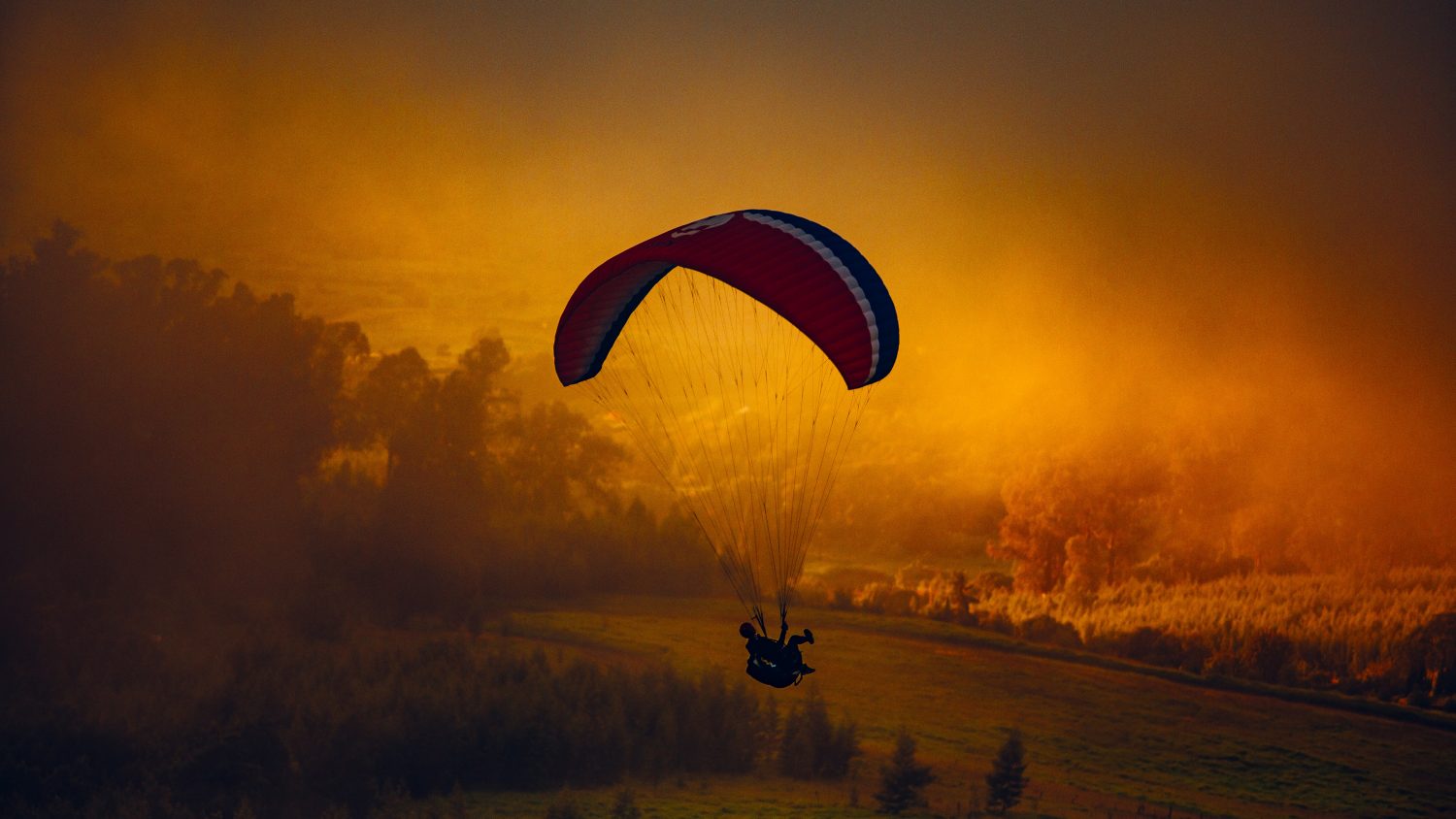 paragliding during sunset