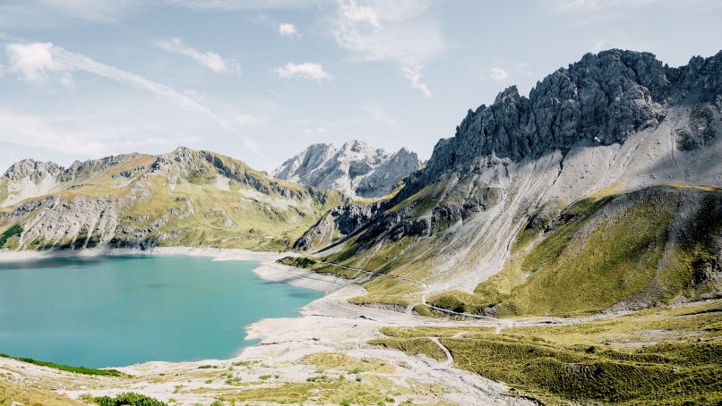 body of water surrounded by mountains