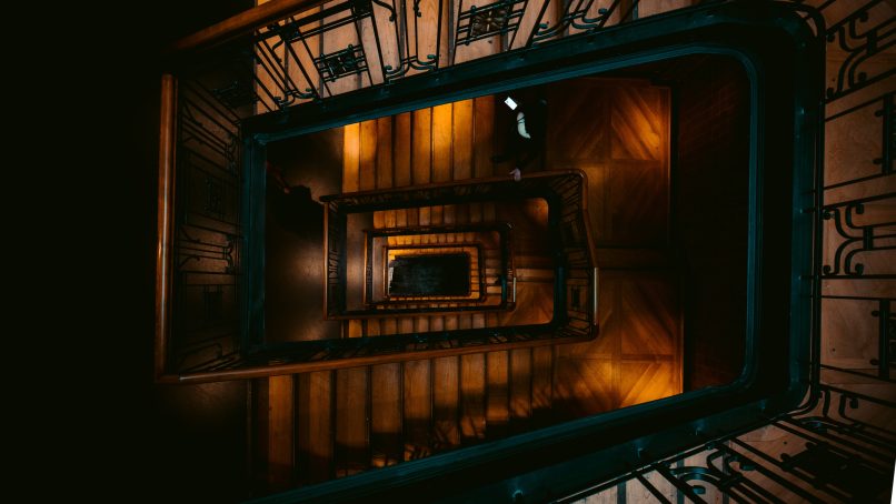 aerial photography of brown and green spiral stairs