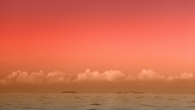 seascape photography of sea under half-moon