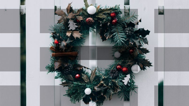 green and white Christmas wreath on wall — Samsung Frame TV art