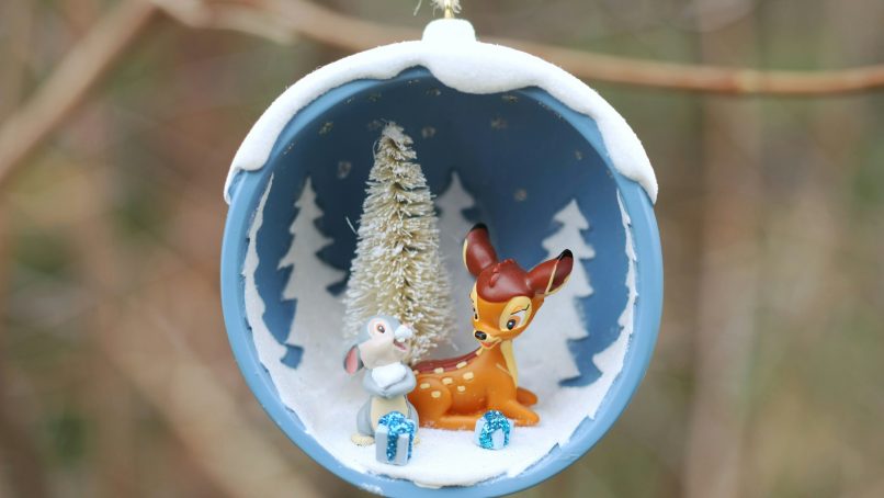 a christmas ornament hanging from a tree