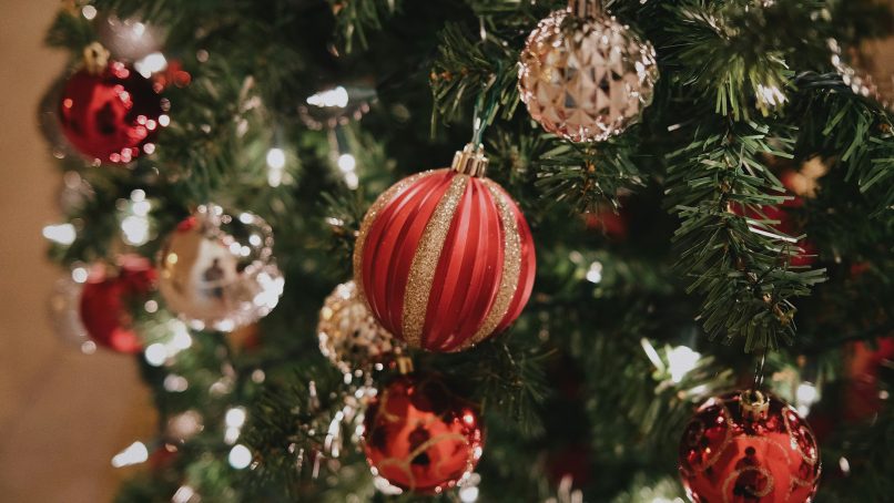 a close up of a christmas tree with ornaments