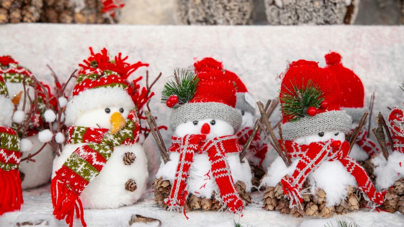 white snowman with red and green christmas baubles