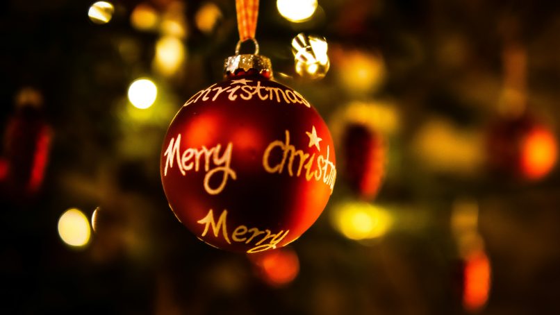 a christmas ornament hanging from a christmas tree