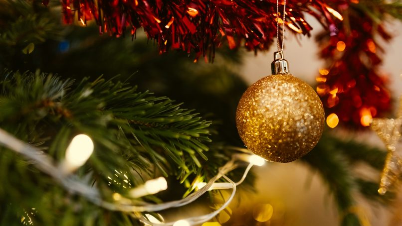 closeup photo of gold glittered Christmas bauble