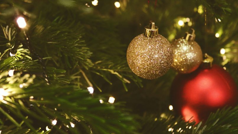 selective focus photo of red and gold baubles