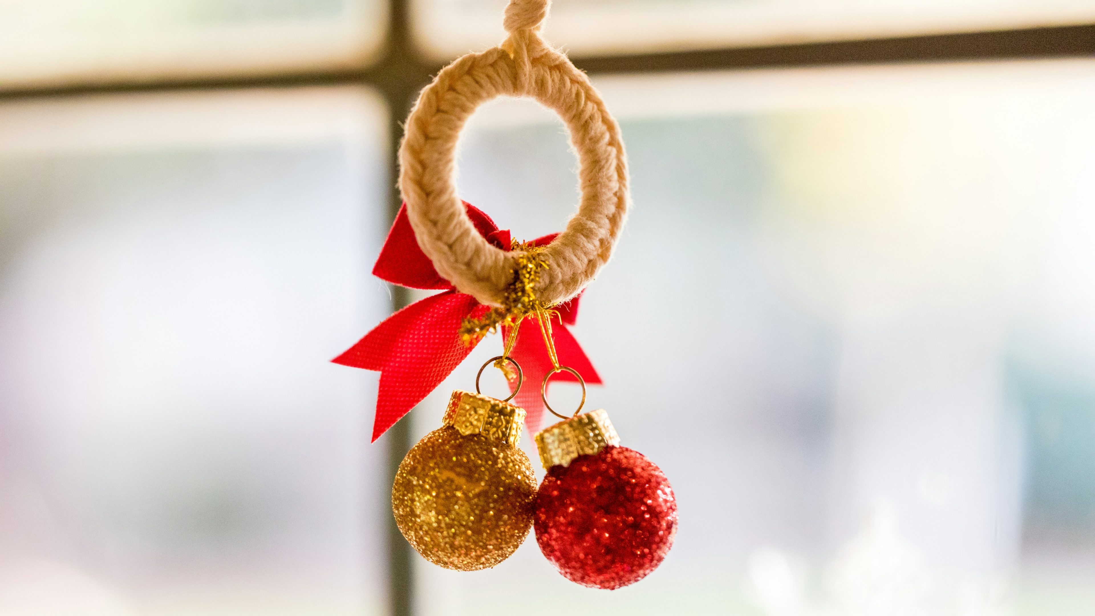 gold and red ball near the window