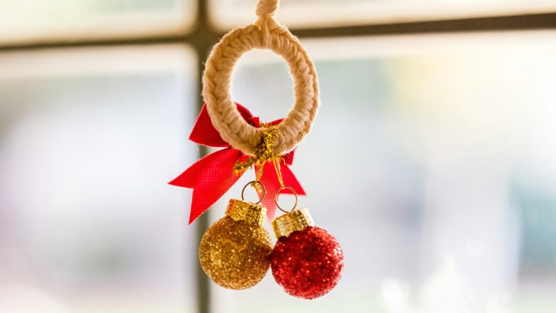 gold and red ball near the window