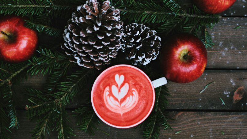 red coffee latte on white ceramic mug