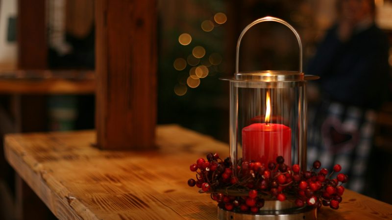 red lighted candle on brown wooden frame — Samsung Frame TV art