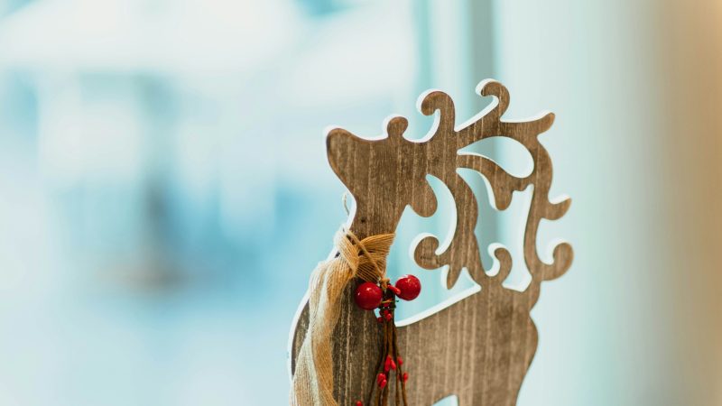 brown wooden carved reindeer decoration on table — Samsung Frame TV art