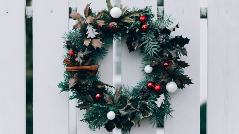 green and white Christmas wreath on wall — Samsung Frame TV art