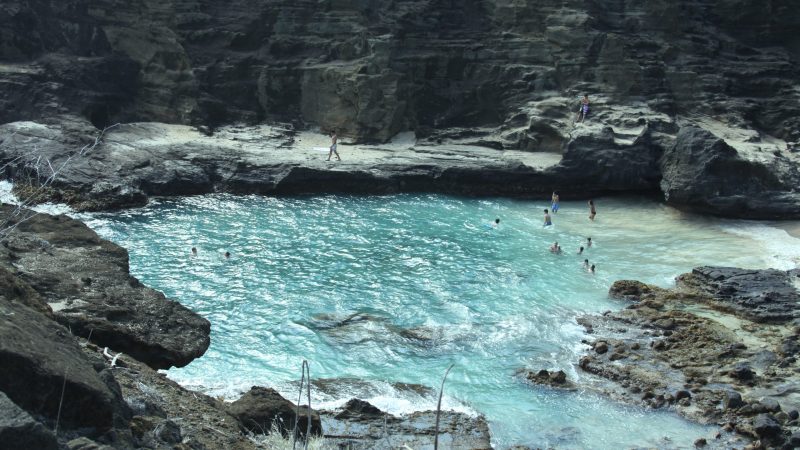 A group of people swimming in a natural pool in Hawaii — Samsung Frame TV art