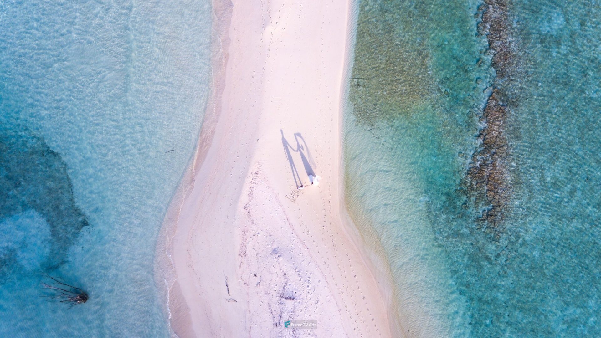 Aerial view of couple on a sandy spit — Samsung Frame TV art