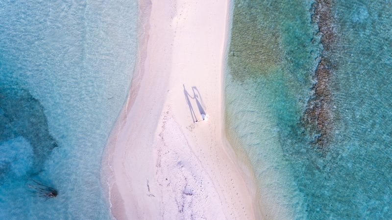 Aerial view of couple on a sandy spit — Samsung Frame TV art