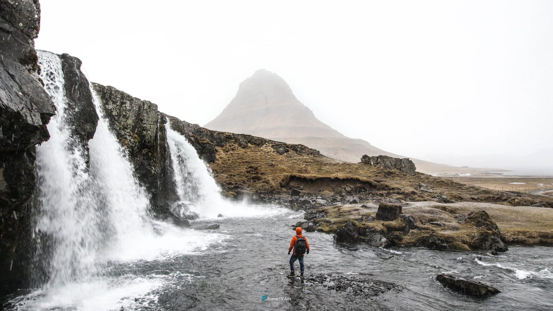 Hiker by a waterfall with a mountain backdrop — Samsung Frame TV art
