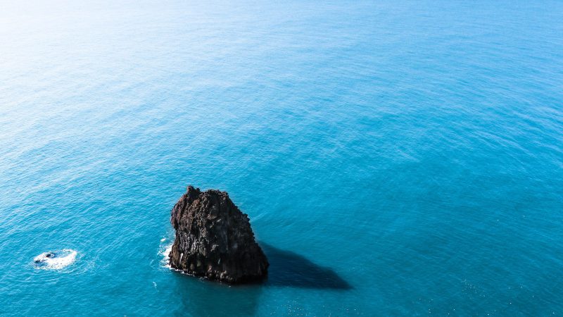 Isolated rock formation in blue sea — Samsung Frame TV art
