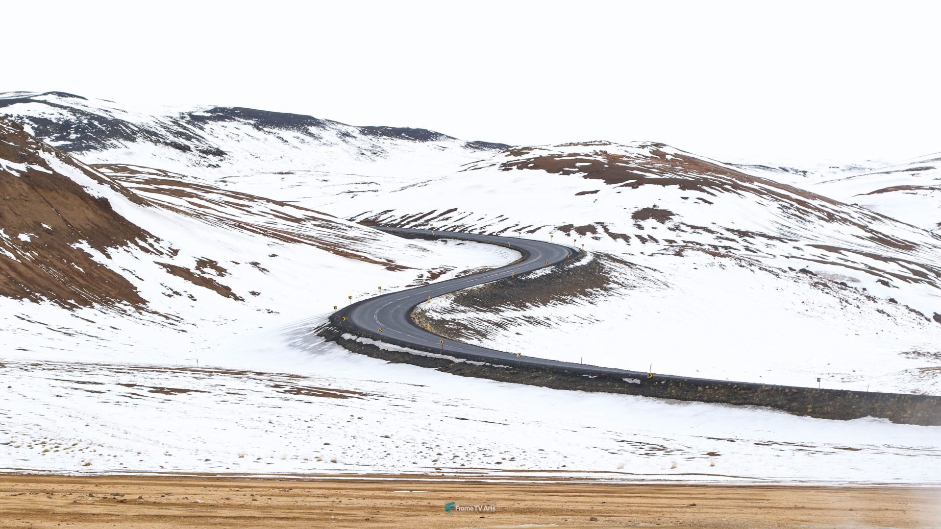 Curvy road through snowy mountain landscape — Samsung Frame TV art