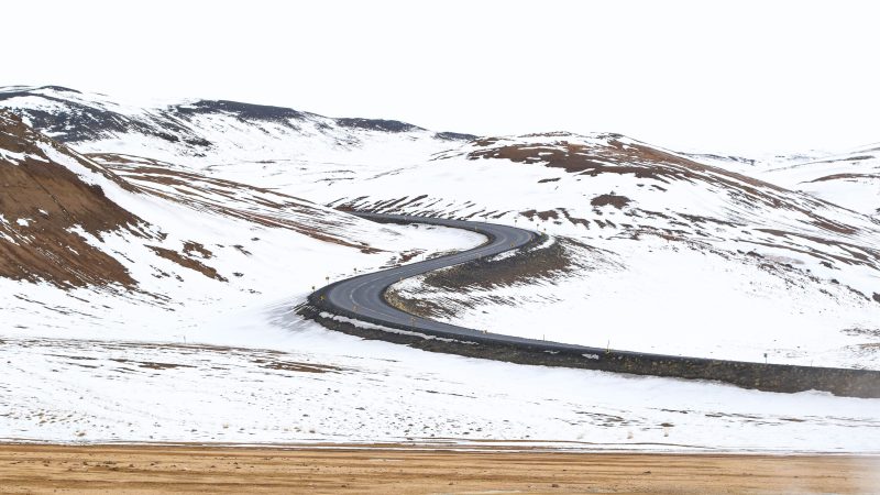 Curvy road through snowy mountain landscape — Samsung Frame TV art