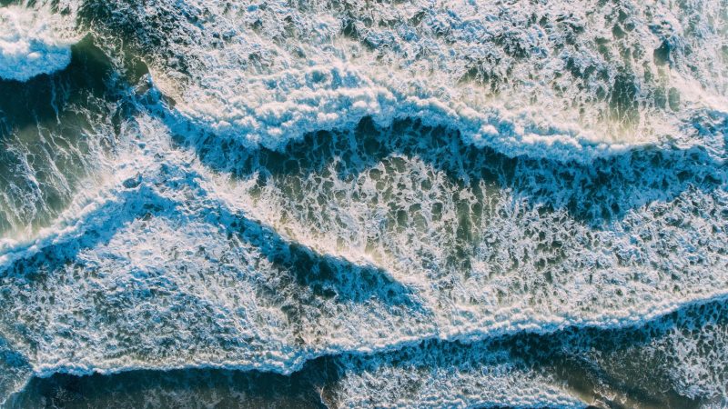 Aerial view of ocean waves crashing creating majestic patterns — Samsung Frame TV art