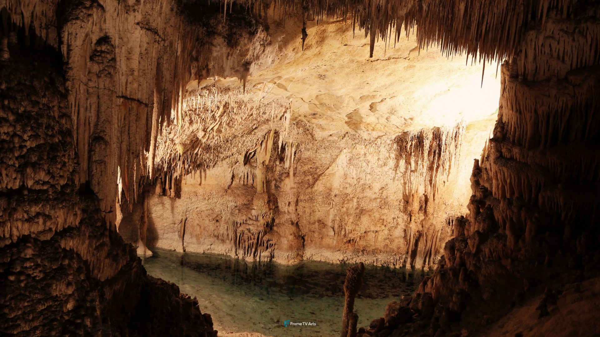 Vast cave with a serene underground pool illuminated by soft light — Samsung Frame TV art