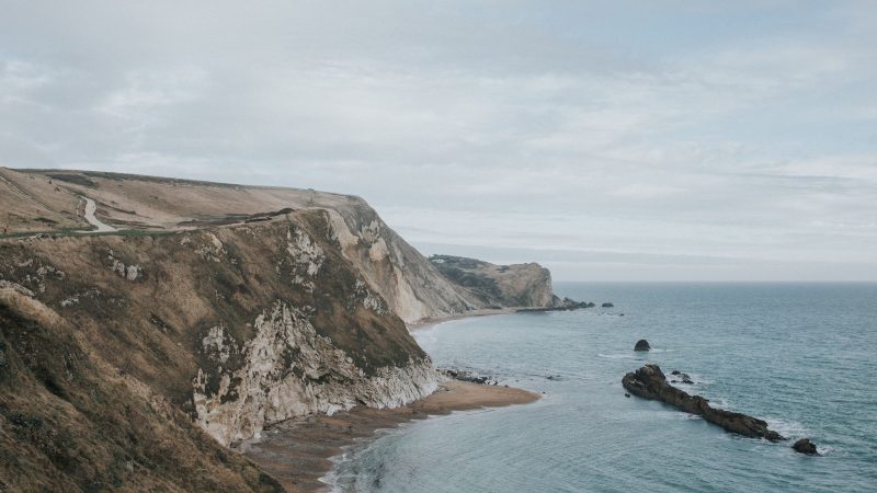 Coastal cliffside overlooking ocean with winding road in foreground — Samsung Frame TV art
