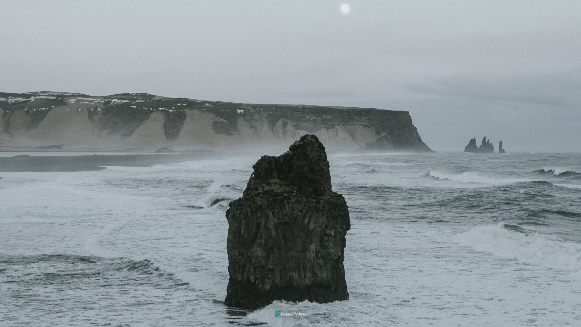 Dramatic coastal rock formations under a cloudy sky at sunset — Samsung Frame TV art