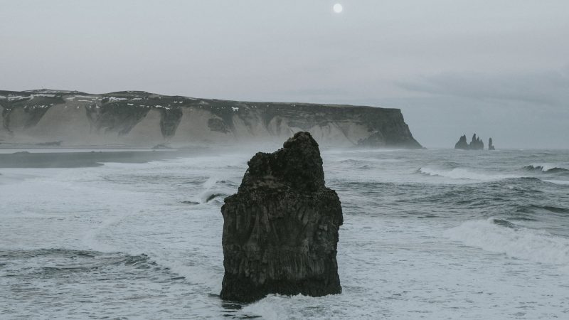 Dramatic coastal rock formations under a cloudy sky at sunset — Samsung Frame TV art