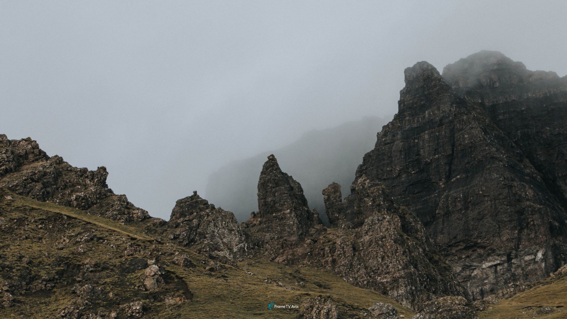 Misty mountain range with dramatic rocky peaks under overcast sky. — Samsung Frame TV art