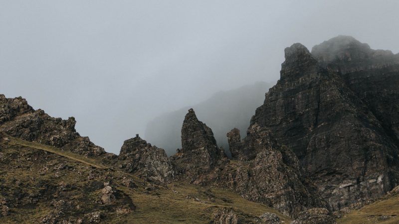Misty mountain range with dramatic rocky peaks under overcast sky. — Samsung Frame TV art
