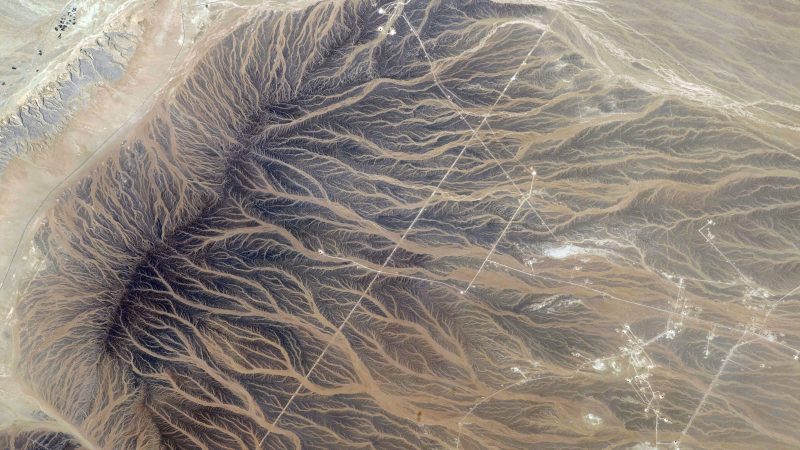 Aerial perspective of desert terrain with intricate patterns of erosion. — Samsung Frame TV art