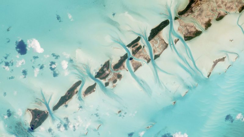 Vibrant aerial view of tropical island with turquoise water and reefs. — Samsung Frame TV art