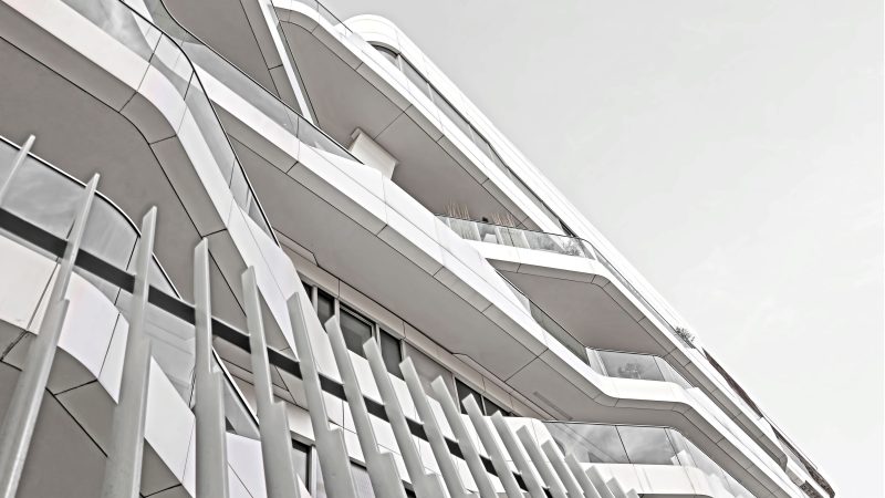 Futuristic white building with reflective glass and curves. — Samsung Frame TV art