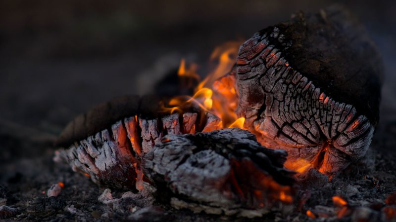 Close-up of glowing embers in a campfire at night. — Samsung Frame TV art