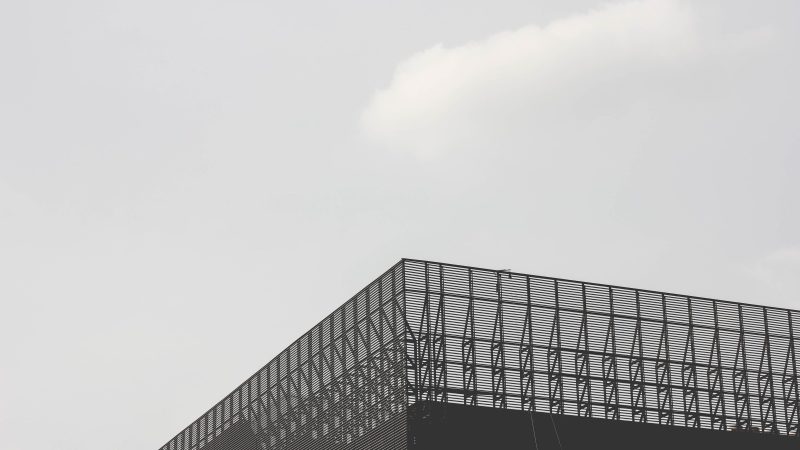 Plane Flying Over Building With Sky Background — Samsung Frame TV art