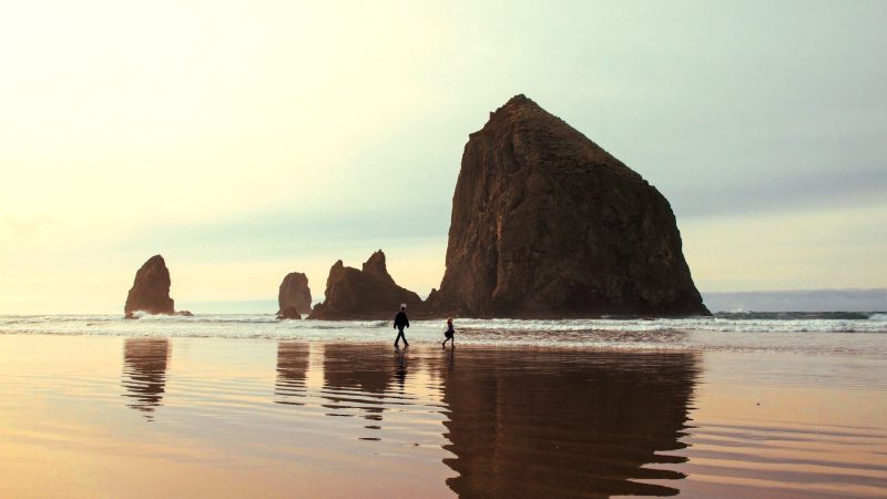 Silhouette of people by a monolithic rock — Samsung Frame TV art