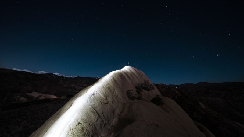 Lone figure under the stars on rock formation — Samsung Frame TV art