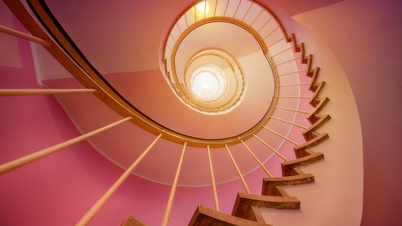 Spiral staircase lit upward with warm glowing light — Samsung Frame TV art