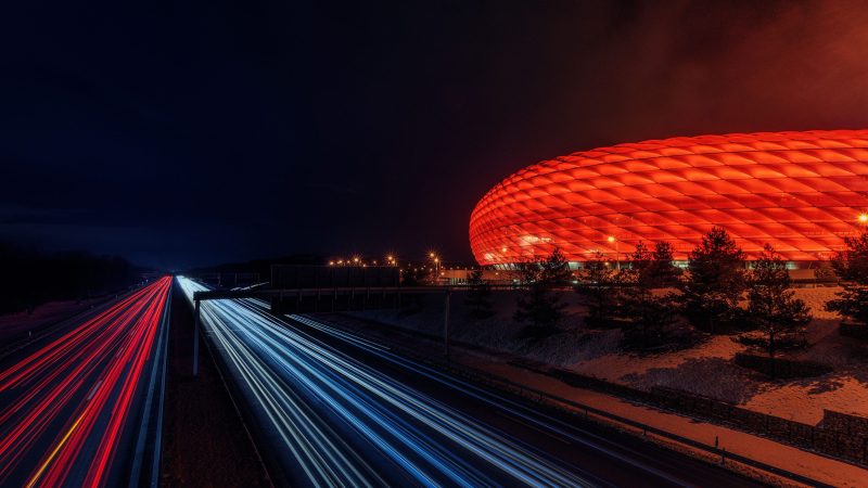 Dramatic light trails on highway near iconic stadium — Samsung Frame TV art
