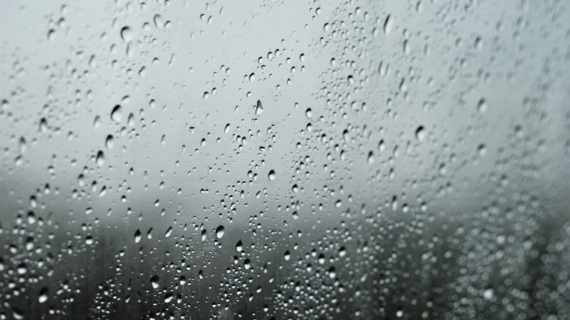 Raindrops on a window with blurred rainy landscape in background. — Samsung Frame TV art