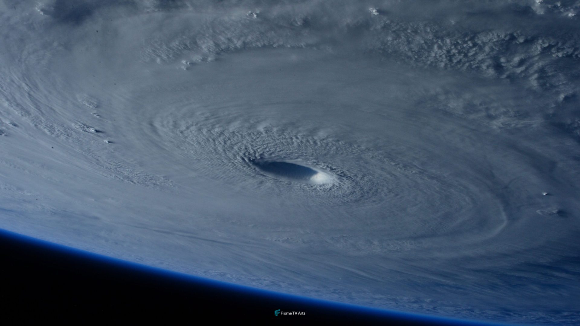 A giant storm system with a clearly defined eye viewed from space. — Samsung Frame TV art