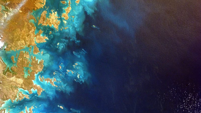 Vivid aerial view of coastal landscape with turquoise waters and land. — Samsung Frame TV art