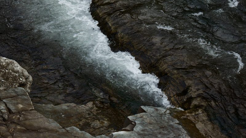 Calm flowing river water over smooth rocks in nature — Samsung Frame TV art