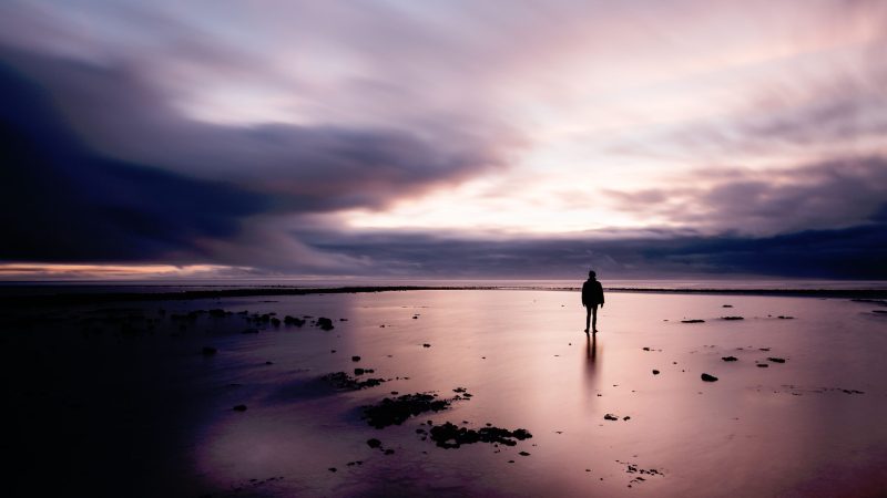 Person standing alone on vast beach at twilight. — Samsung Frame TV art