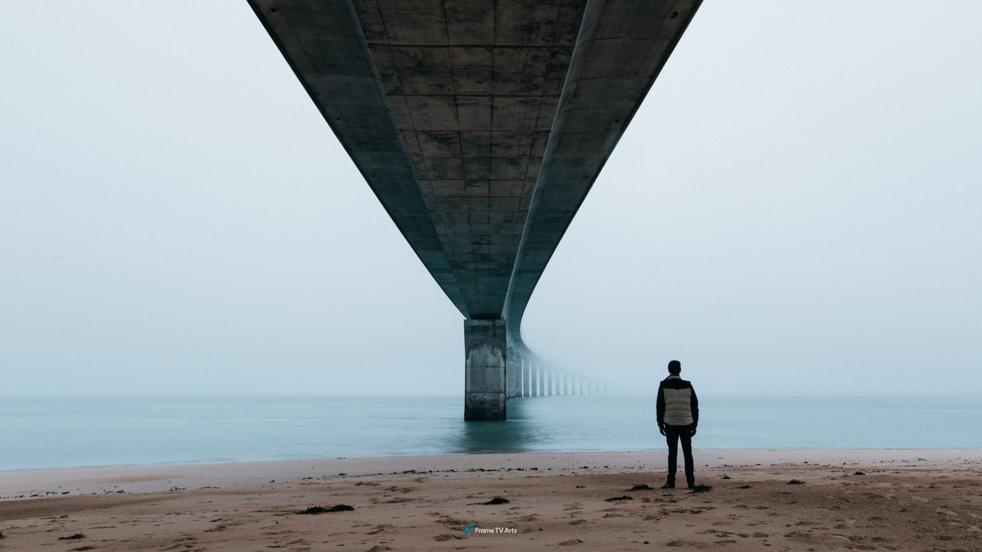 Lone figure stands beneath vast, foggy bridge into horizon — Samsung Frame TV art