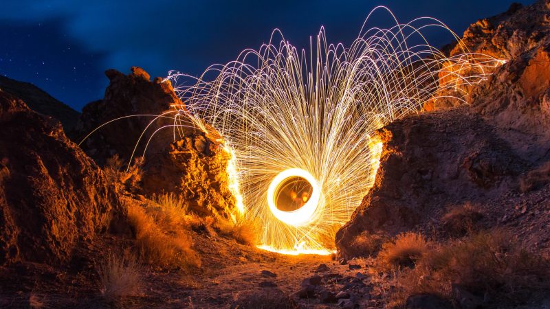 Sparks fly in a rocky canyon under the night sky — Samsung Frame TV art