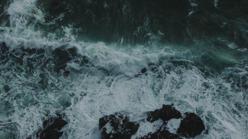 Waves crashing on rocky shore with dark, turbulent waters foaming. — Samsung Frame TV art