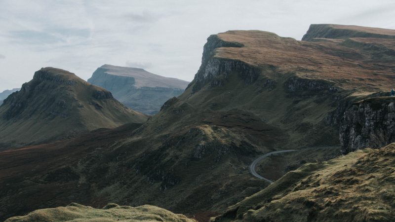 Majestic mountain ridges under a cloudy sky with a winding road — Samsung Frame TV art